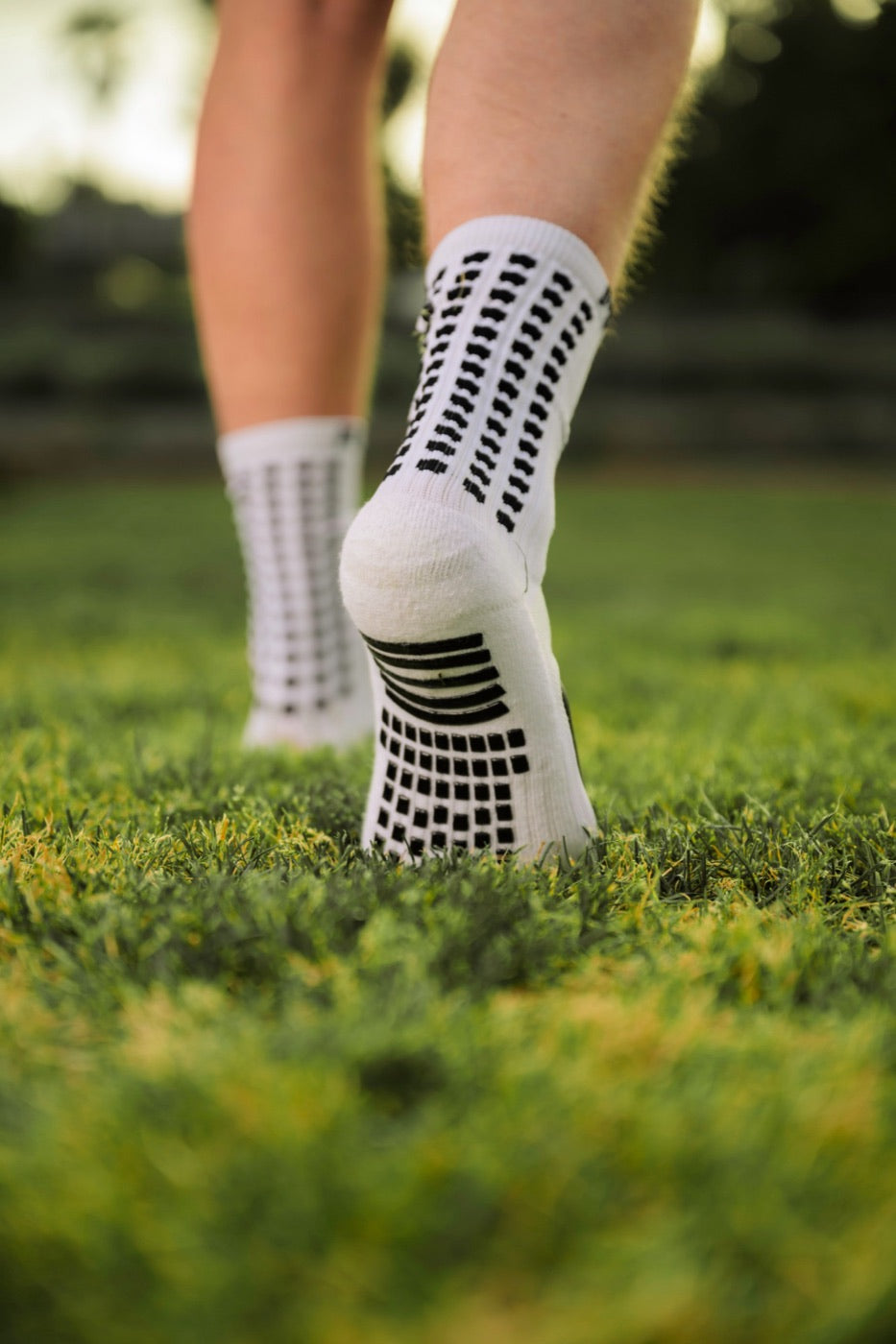 Heel and back of a MediCaptain grip sock showing rows of grip pads
